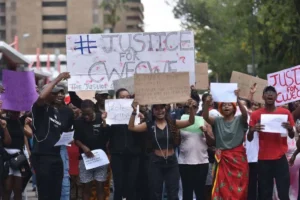 Students and civic groups march for justice in the Cwecwe rape case, highlighting investigation delay.