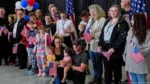 Group of Afrikaner refugees welcomed in the US under Trump administration policy citing discrimination.
