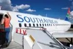 South African Airways jet parked at airport symbolizing strategic downsizing and turnaround.