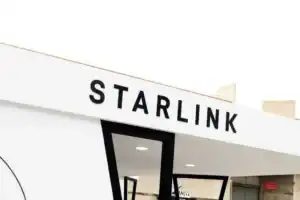 Starlink satellite dish providing free internet to smiling students at a rural South African school.