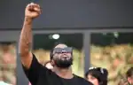 Sean Combs reacts emotionally in courtroom after being found not guilty of racketeering charges.