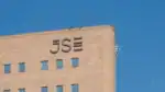 JSE hits 100 000 milestone on FTSE/JSE All‑Share Index chart.