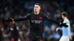 Patrik Schick celebrates scoring as Bayer Leverkusen beat Manchester City 2-0 in Champions League.