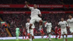 Nottingham Forest players celebrate their 3-0 Premier League victory over Liverpool at Anfield.