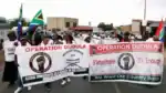 Police arrest protesters outside the G20 Summit in Johannesburg during clashes.