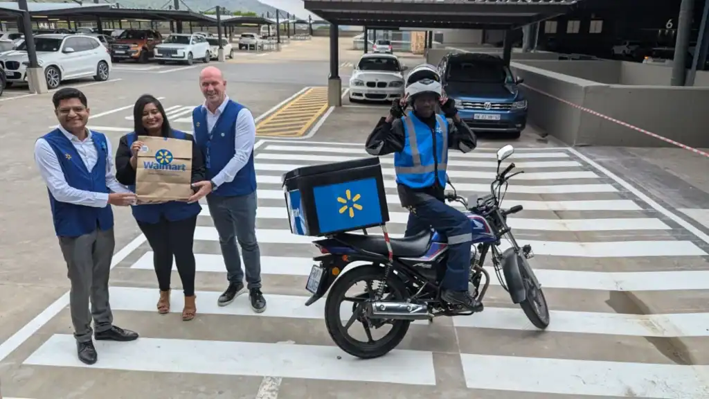 Walmart South Africa delivery scooter driver ready for 60-minute grocery delivery.