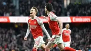 Martin Odegaard celebrates scoring the opening goal in Arsenal 2-1 victory against Brighton 2025.