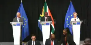 European Union and South Africa strategic partnership flags symbolizing green energy cooperation.