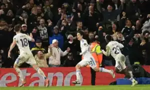Ao Tanaka celebrates scoring the 96th-minute equalizer for Leeds United against Liverpool.