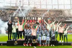 Orlando Pirates players celebrate winning the Carling Black Label Cup at Moses Mabhida Stadium.