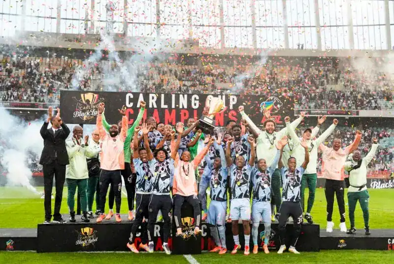 Orlando Pirates become the first club to win both Carling Tournaments Orlando Pirates players celebrate winning the Carling Black Label Cup at Moses Mabhida Stadium.