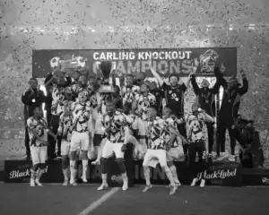 Orlando Pirates players lifting the Carling Knockout trophy after beating Marumo Gallants.