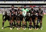 Orlando Pirates players celebrating top spot in Betway Premiership standings before AFCON break.