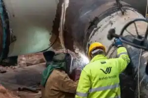 Rand Water technicians repairing aging water infrastructure during phase 2 of maintenance work 2025.