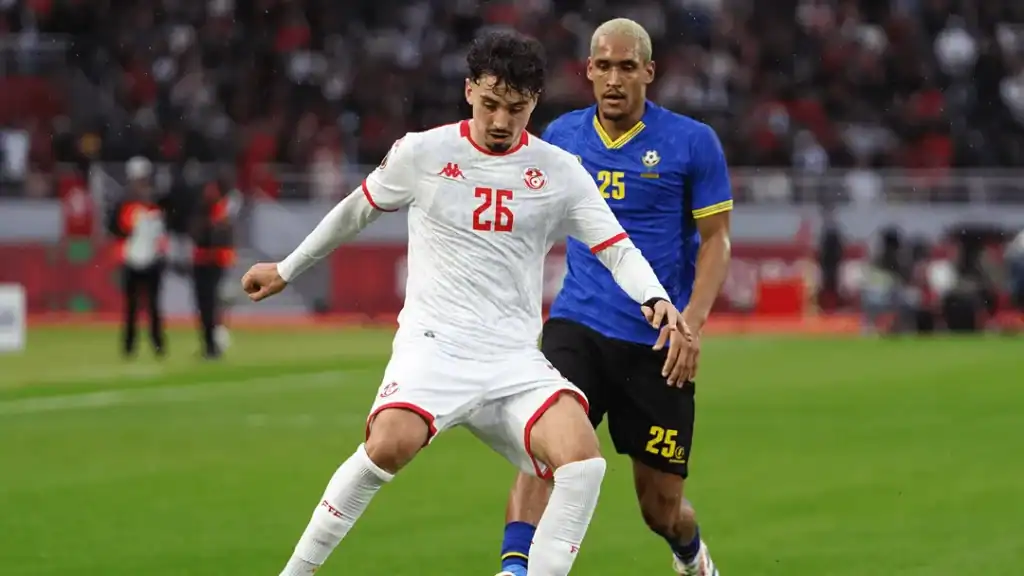 Tanzania and Tunisia players shake hands as both teams reach the last 16 at AFCON with a 1-1 draw.