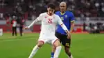 Tanzania and Tunisia players shake hands as both teams reach the last 16 at AFCON with a 1-1 draw.