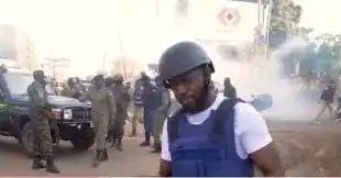 Bobi Wine tells CNN: This is not an election its war; supporters wave People Power NUP flags.