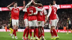 Arsenal players celebrate victory over Kairat Almaty in UEFA Champions League 2025-26 match