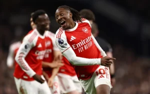 Arsenal celebrate a 4-1 North London derby win over Tottenham to stay five points clear in title race