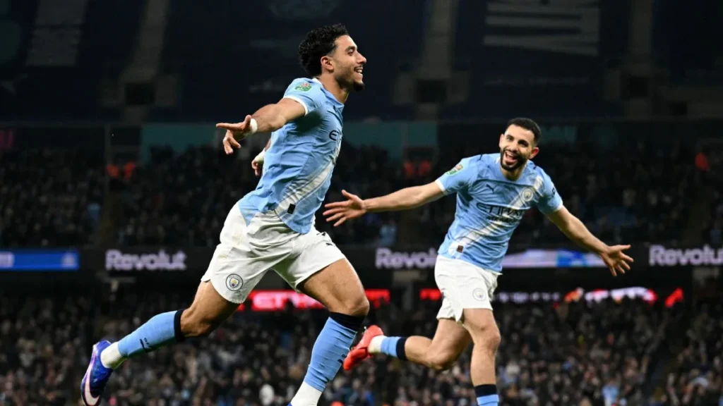Omar Marmoush and Tijjani Reijnders celebrate after scoring against Newcastle at the Etihad.