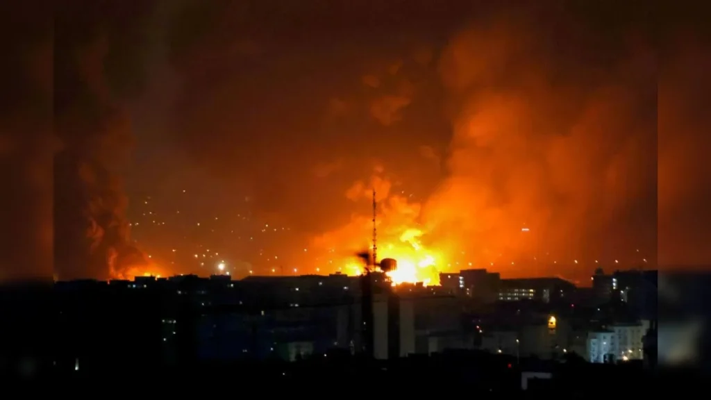 Smoke rises over Tehran after Israeli airstrikes as US warns Iranian civilians to stay indoors.