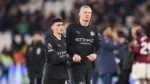 Man City title hopes dented after West Ham draw as Bernardo Silva and Erling Haaland look on.