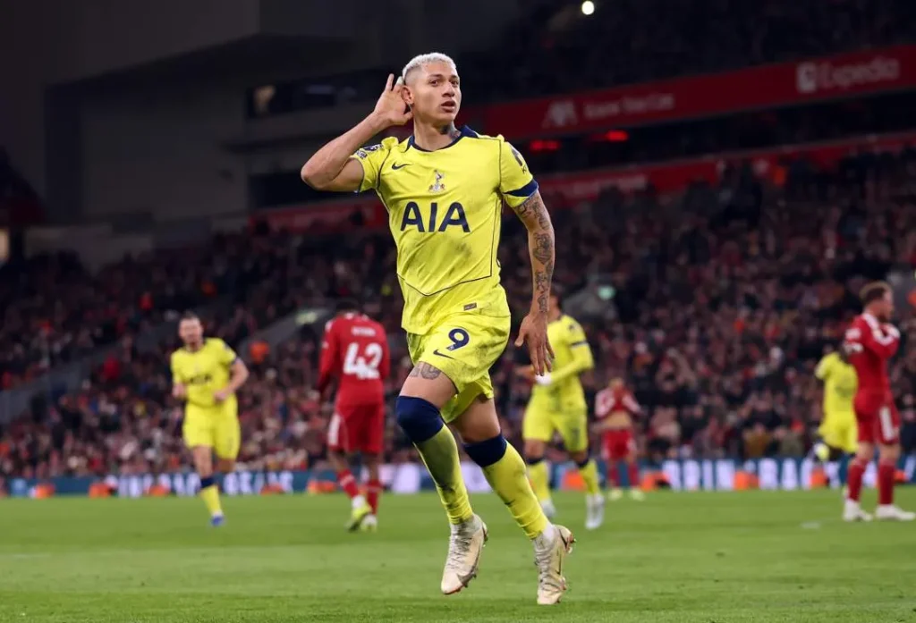Richarlison scores a 90th-minute equalizer as Spurs strike late to stun Liverpool at Anfield stadium.