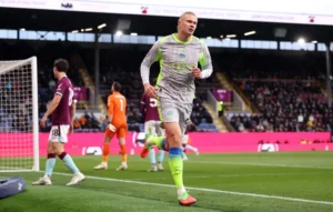 Erling Haaland scores as Man City defeat Burnley 1-0 in the Premier League to go top of the table.