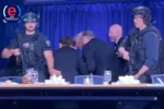 Trump rushed off stage after shots fired at WHCD dinner by armed suspect.