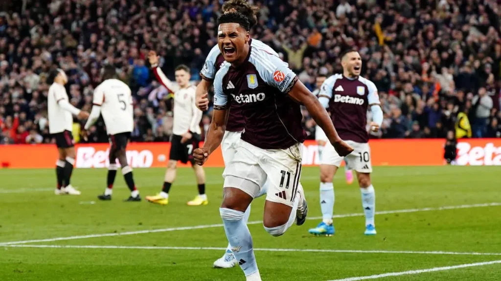Ollie Watkins celebrates as Aston Villa beats Liverpool 4-2 to qualify for the Champions League.