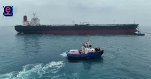 Smoke rising from a US warship after being struck by Iranian missiles in the Strait of Hormuz.