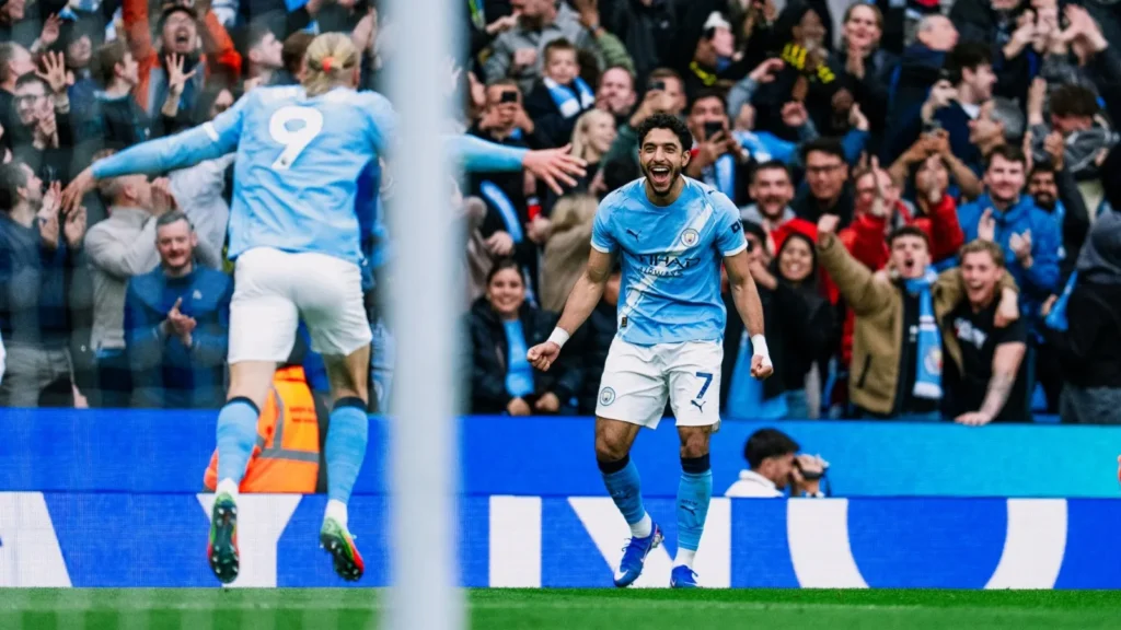 Jeremy Doku celebrates his opening goal for Manchester City against Brentford at the Etihad Stadium.