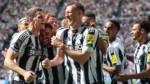 Newcastle United players celebrate their 3-1 Premier League victory against Brighton.