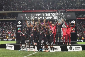 Orlando Pirates players celebrate winning the PSL title at Mbombela Stadium, ending a 14-year wait.
