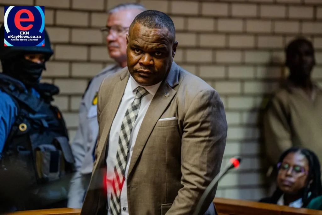 Suspended police sergeant Fannie Nkosi arrives at court under heavy guard facing corruption charges.