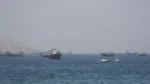 A US Navy frigate patrolling the Strait of Hormuz amid missile strike denials.