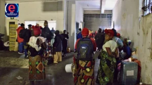 Malawian nationals wait for assistance in Johannesburg after repatriation buses lacked permits.