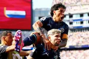 Paraguay players celebrate after defeating Germany on penalties to reach the FIFA World Cup Round of 16.