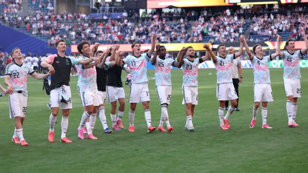 Belgium players celebrate after defeating the USA 4-1 to reach the FIFA World Cup 2026 quarter-finals.