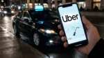 Traveller uses Uber app at airport amid warnings about fake Uber scams in South Africa.